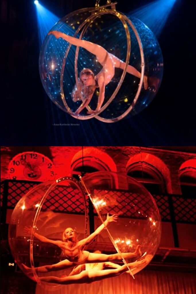 Showact mit Artistin und Sängerin in einer schwebenden Plexiglas-Kugel – elegante Luftakrobatik kombiniert mit Live-Gesang über dem Publikum